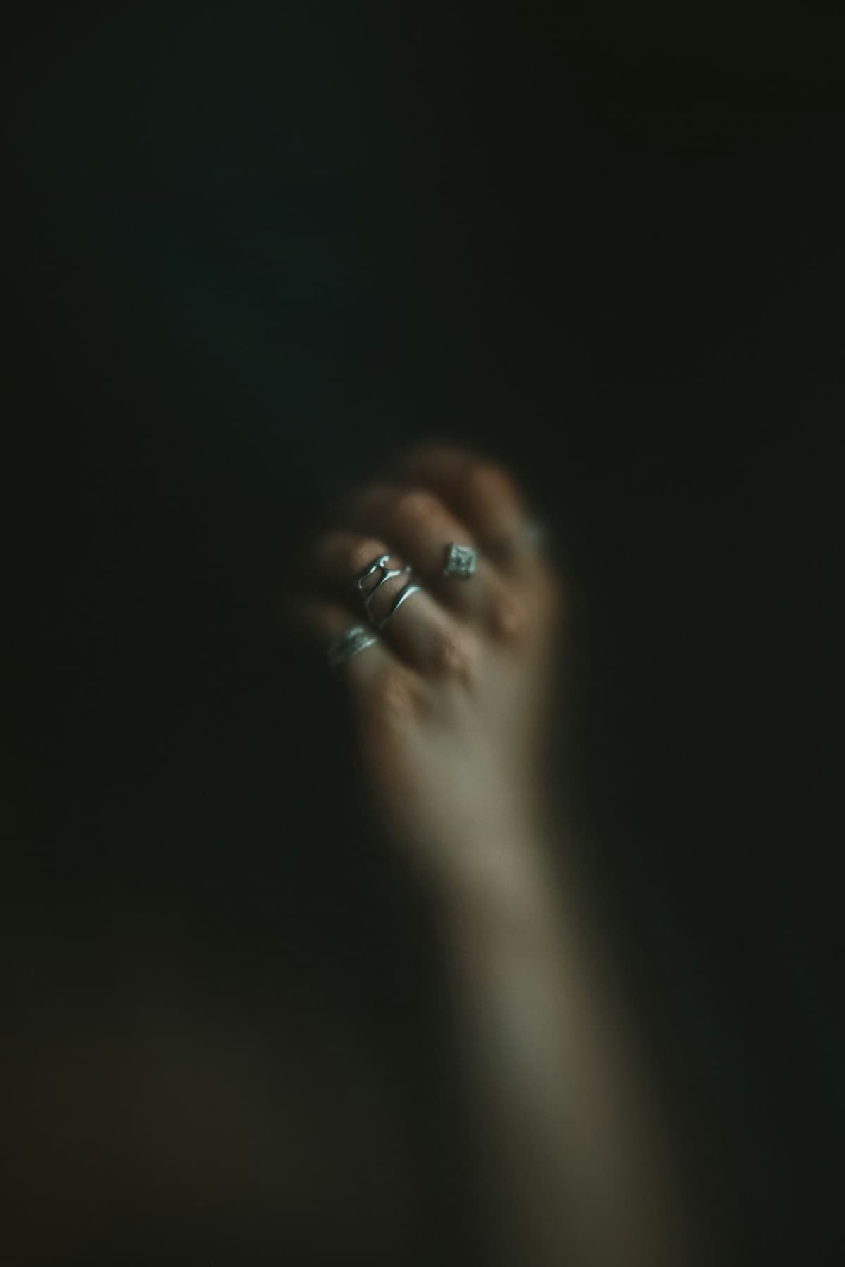 Ring on hand in dark setting